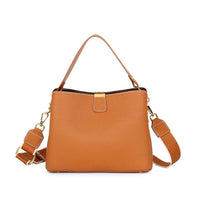 Brown leather handbag with gold hardware and detachable shoulder strap on white background