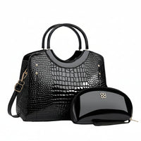 Black crocodile pattern handbag with matching glossy black makeup pouch, gold details