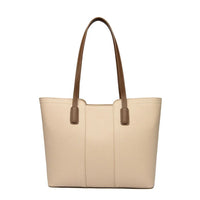 Beige leather tote bag with brown handles on white background