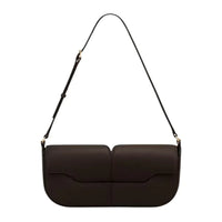 Minimalist dark brown leather shoulder bag with adjustable strap on white background