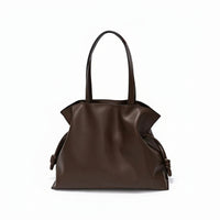 Brown leather tote bag with knotted side details on a white background