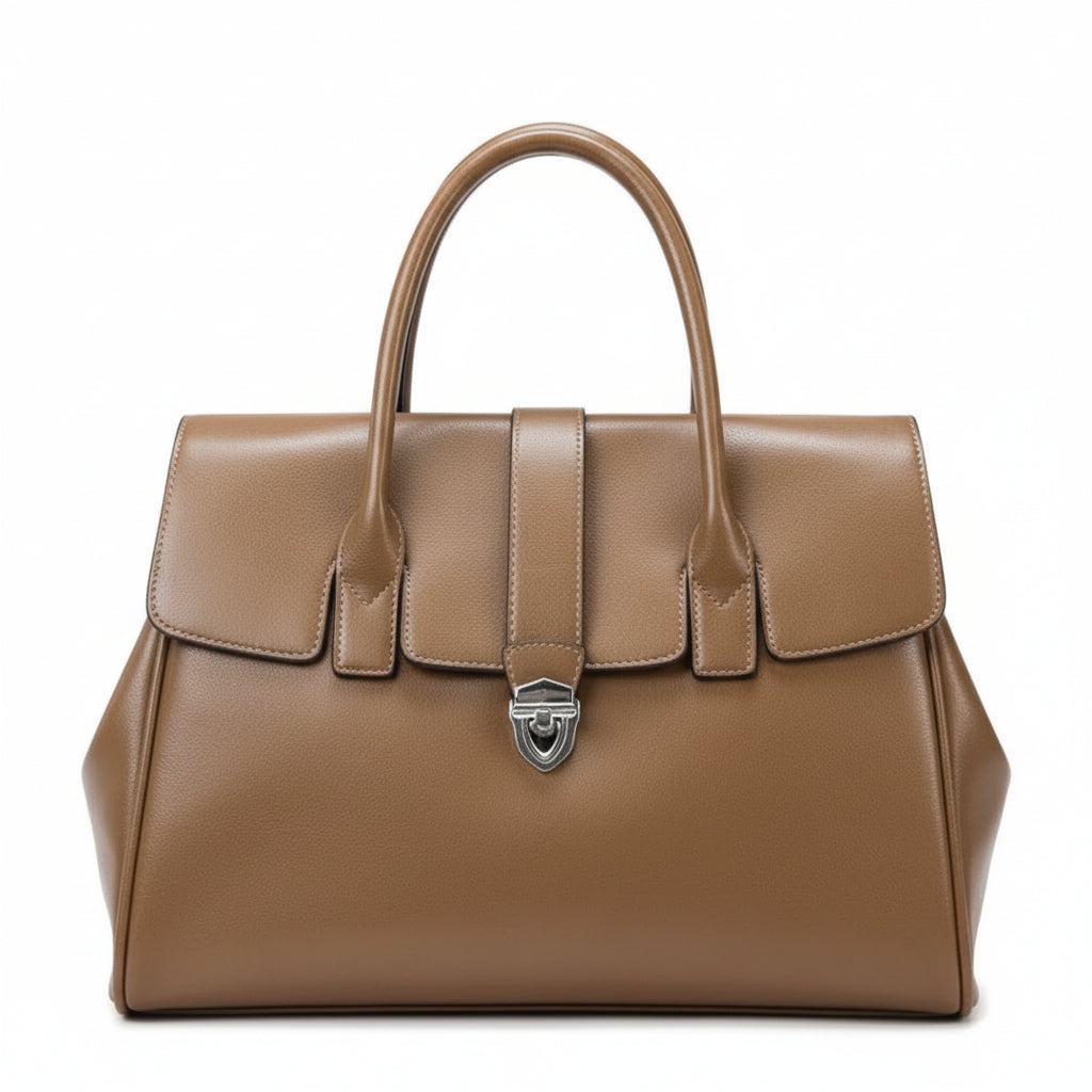 Brown leather handbag with silver clasp and double handles on white background