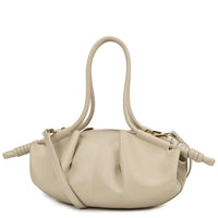 Beige leather handbag with knotted handles and gathered design on white background