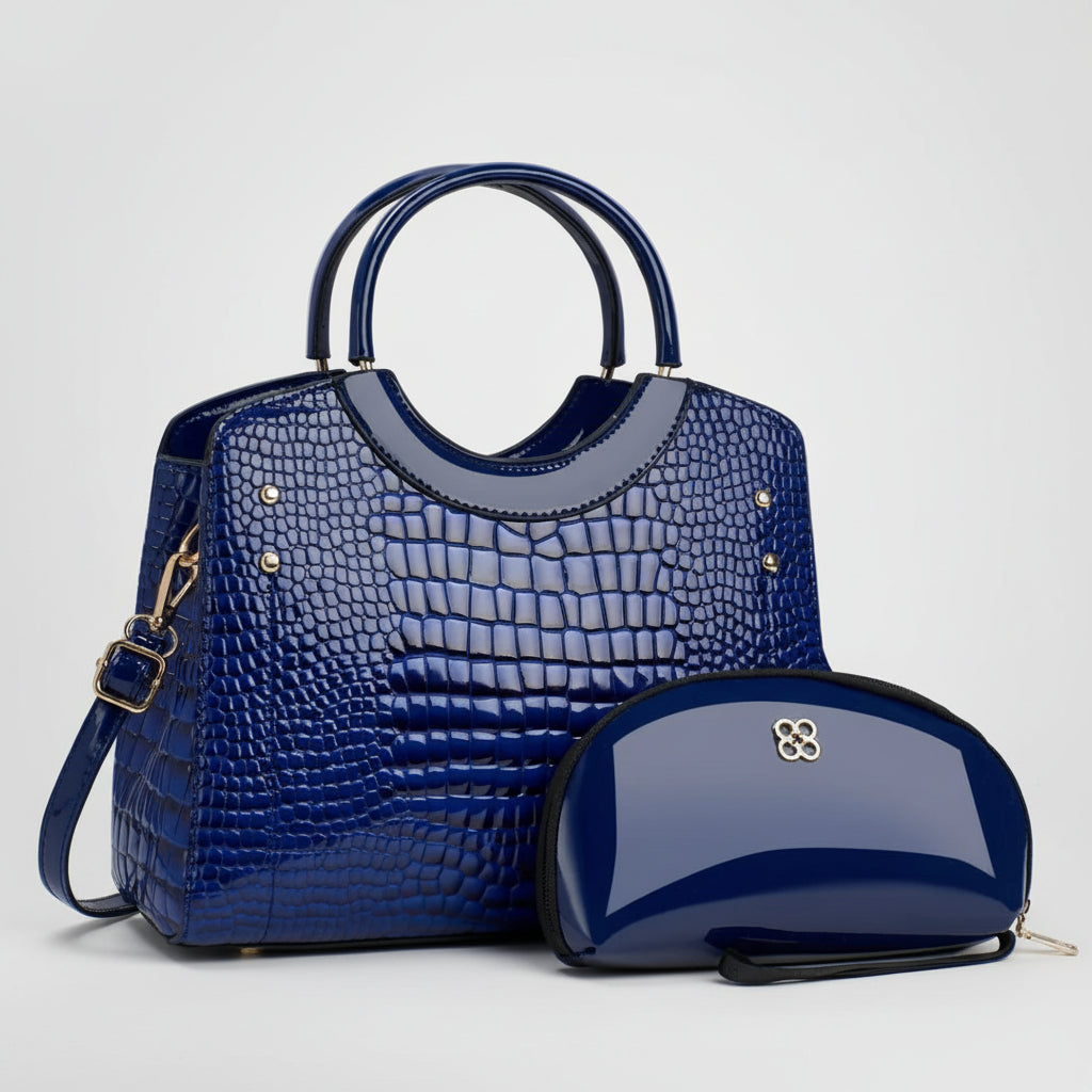 Glossy blue crocodile pattern handbag with matching blue patent leather clutch