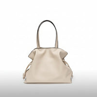 Beige leather tote bag with double handles and knotted side details on white background