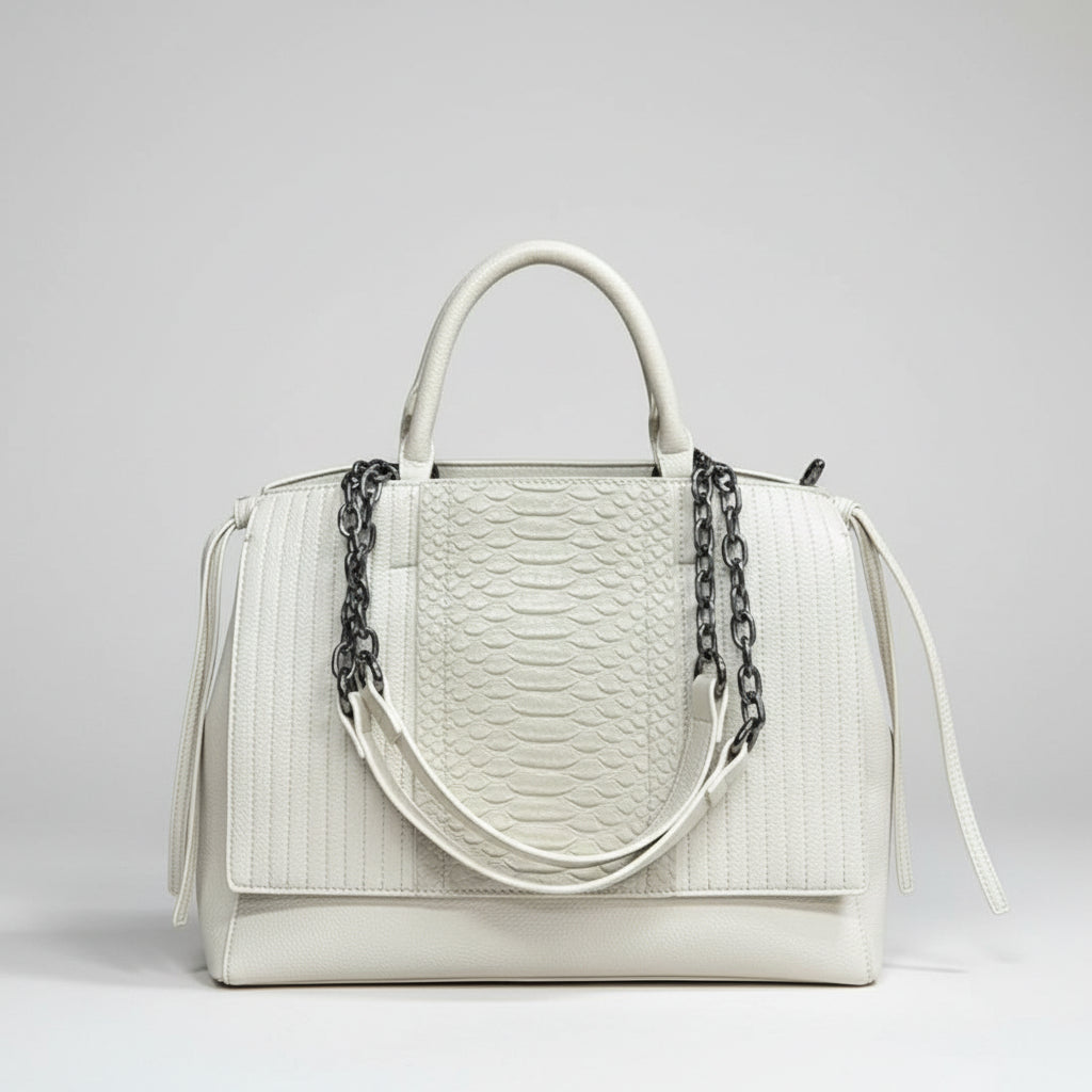 White leather handbag with textured snakeskin pattern and black chain detail