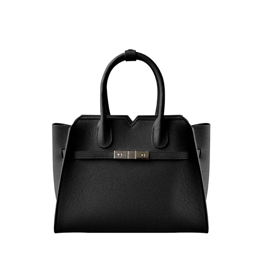 Black leather tote bag with double handles and silver buckle, minimalist handbag