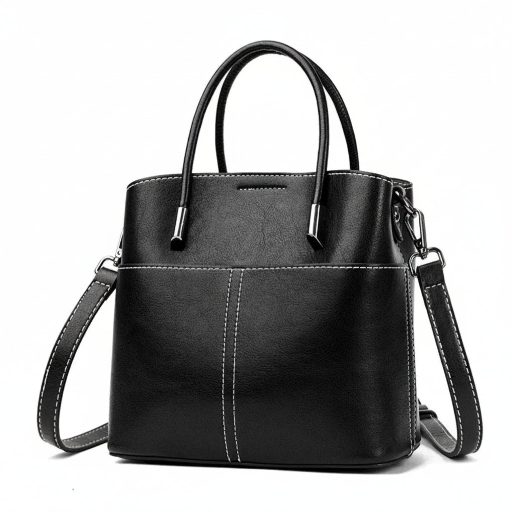 Black leather handbag with white stitching, top handles, and a detachable shoulder strap