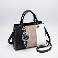 Colorblock faux crocodile leather handbag with gold hardware, pompom keychain, and shoulder strap