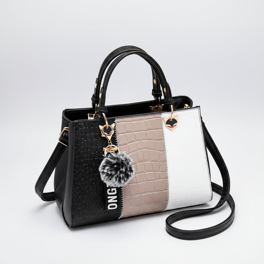 Colorblock faux crocodile leather handbag with gold hardware, pompom keychain, and shoulder strap