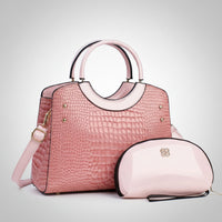Pink crocodile pattern handbag with matching glossy cosmetic bag