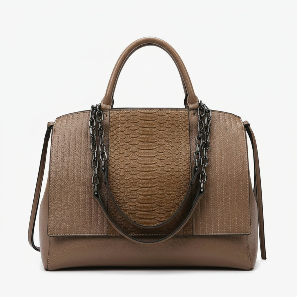 Brown textured leather handbag with chain strap and top handles against white background