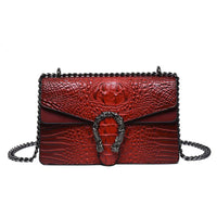 Red crocodile pattern leather shoulder bag with silver chain strap and textured buckle