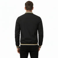 Black bomber jacket with yellow and white trim on a white background