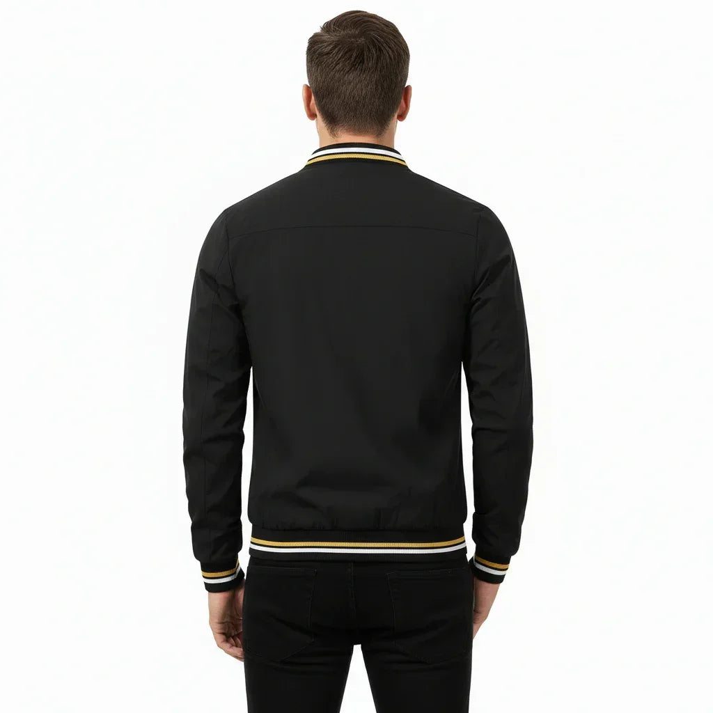 Black bomber jacket with yellow and white trim on a white background