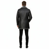 Man wearing a black leather coat with gray fur lining on a white background