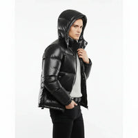 Person wearing a black puffer jacket on a white background