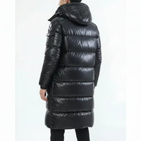 Person wearing a black puffer coat on a white background