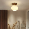 White Spherical Corridor Ceiling Light for Modern Spaces - Rebooters