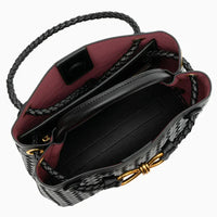 Open black woven leather handbag with braided handle and gold hardware, red interior lining
