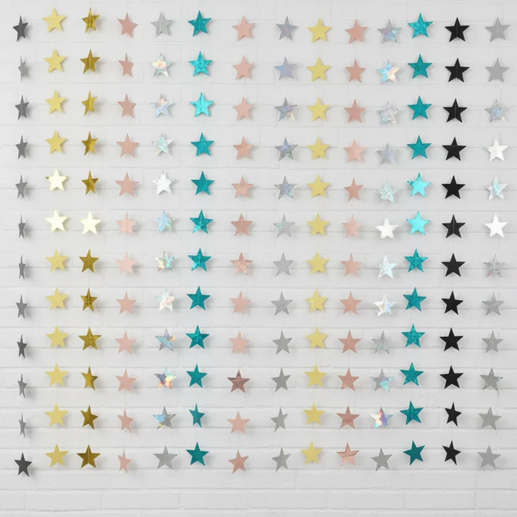 Star-shaped confetti in gold, pink, and silver on a white background
