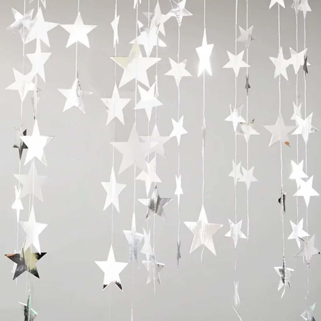 Star-shaped decorations hanging against a gray background
