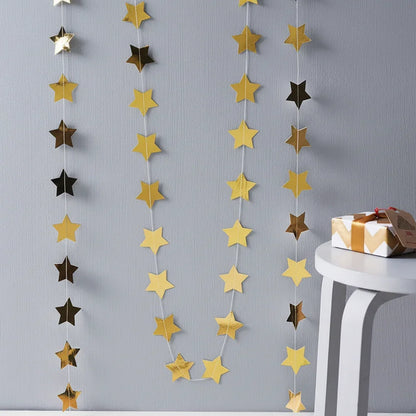 Star-shaped garland with gold and black stars on a gray background