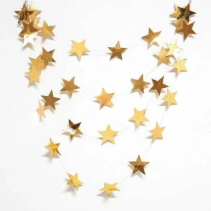 Gold star-shaped confetti on a white background