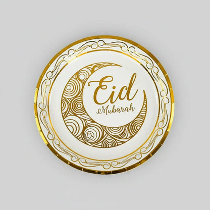 Decorative plate with 'Eid Mubarak' text on a marble surface