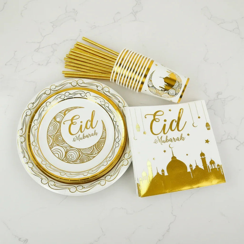 Eid-themed paper plates, cups, and napkins on a light marble surface