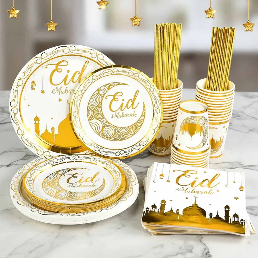 Eid Mubarak-themed paper plates, cups, and napkins on a Marble surface with gold accents.