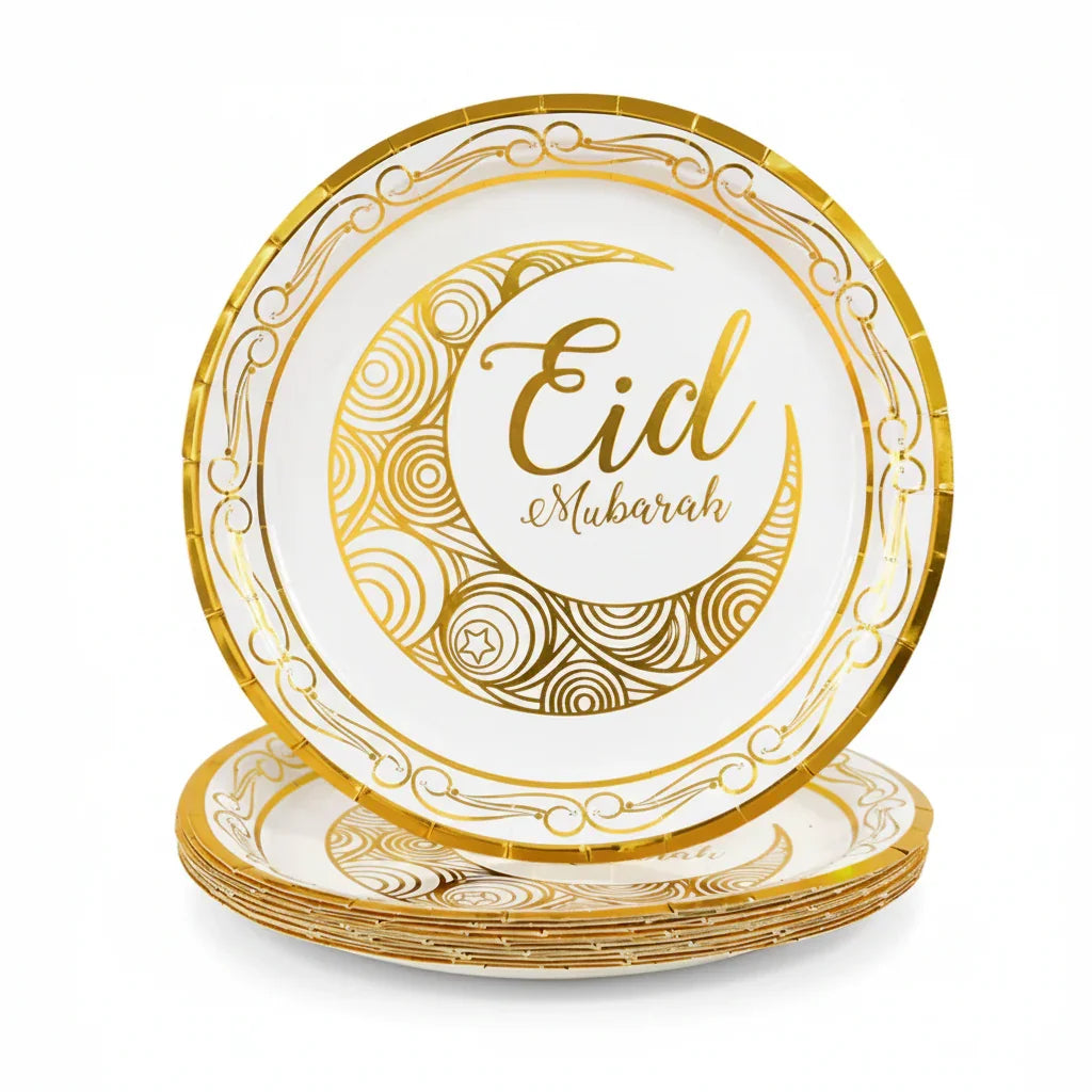 Set of gold and white 'Eid Mubarak' plates on a white background