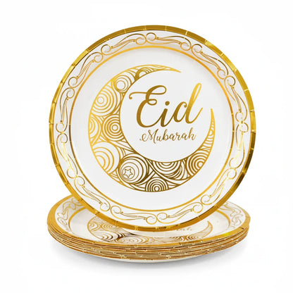 Set of gold and white 'Eid Mubarak' plates on a white background