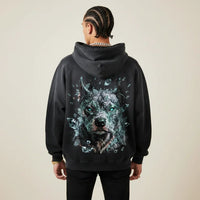 Person wearing a black hoodie with a Pitbull graphic on the back against a plain background