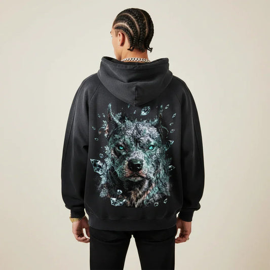 Person wearing a black hoodie with a Pitbull graphic on the back against a plain background