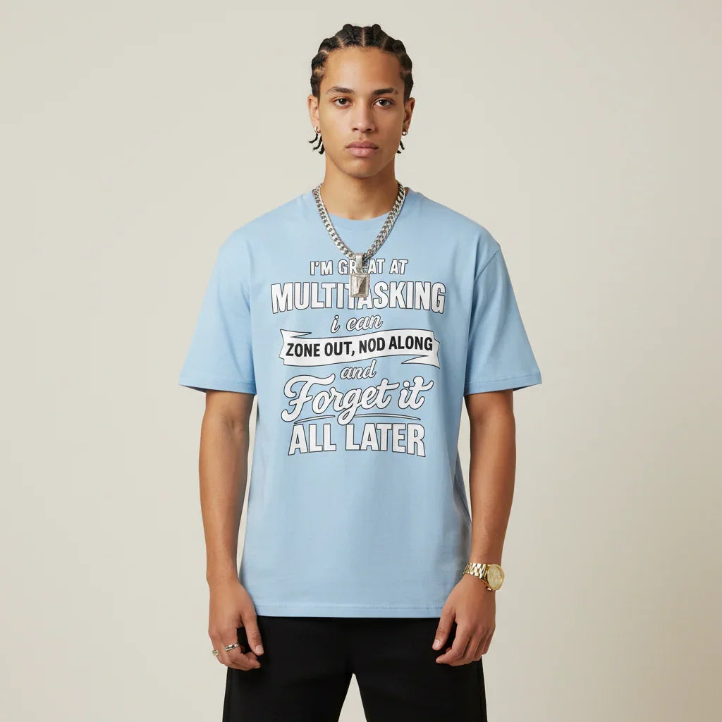 Person wearing a I'm Great at Multitasking light blue t-shirt on a plain background