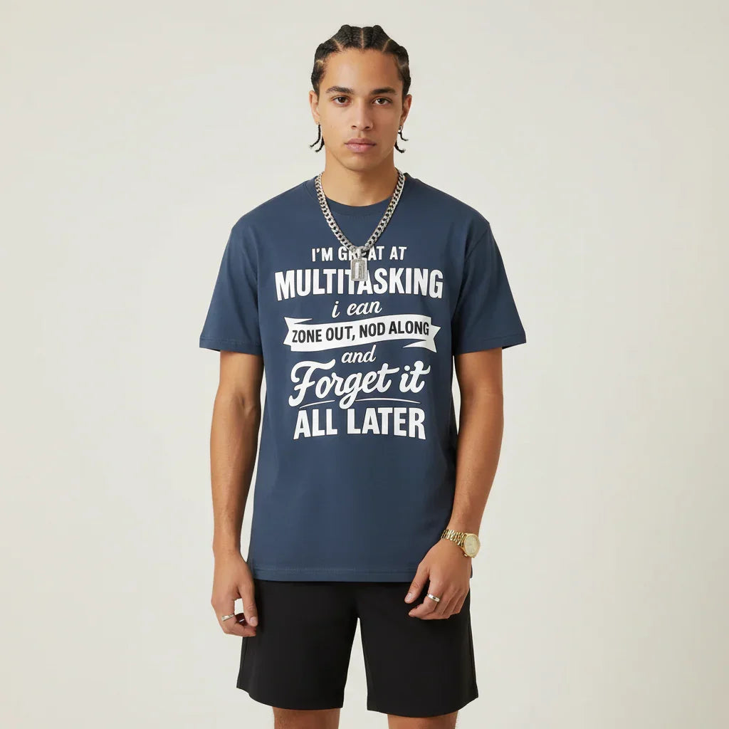 Person wearing a I'm Great at Multitasking blue t-shirt on a plain background