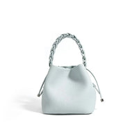 Light blue leather handbag with braided handle and drawstring, minimalist style