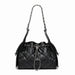 Black quilted leather shoulder bag with chain strap and drawstring closure on white background.