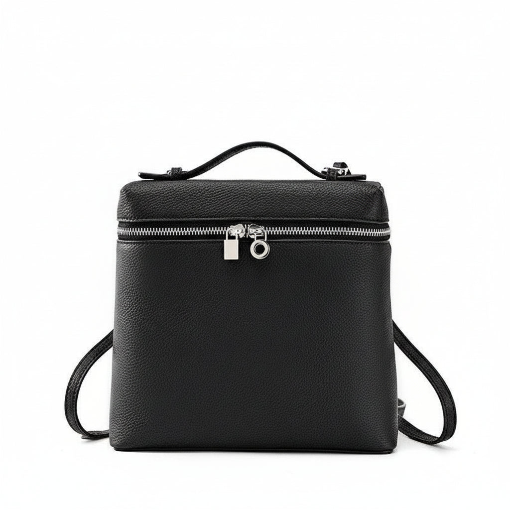 Black leather backpack with top handle, silver zipper, and lock on white background