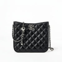 Black quilted leather crossbody bag with silver chain strap and metal logo on white background