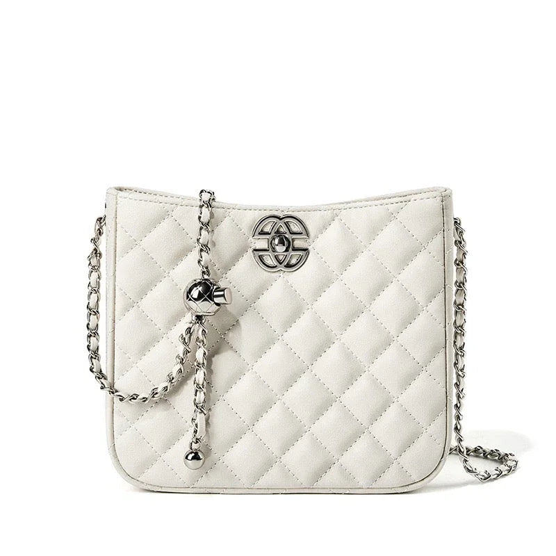 White quilted shoulder bag with silver chain strap and metal logo on front
