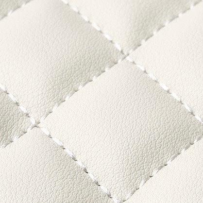 White quilted faux leather upholstery with square stitching texture