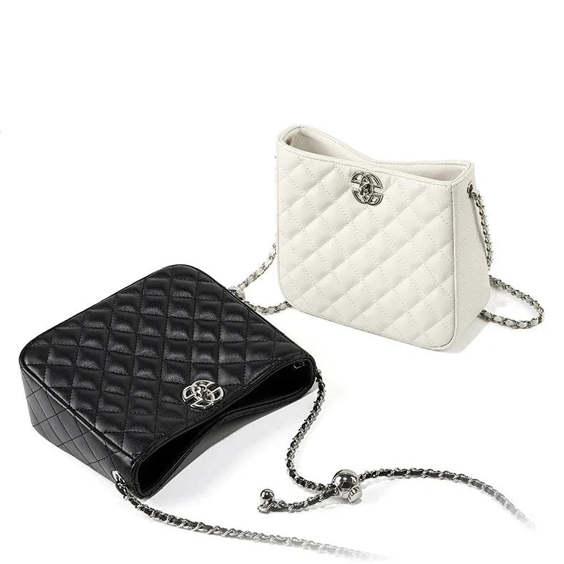 Quilted black and white leather handbags with chain straps on white background