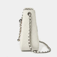 White quilted leather handbag with silver chain strap on white background