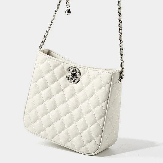 White quilted leather shoulder bag with silver chain strap and metal logo on front