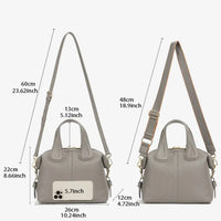 Gray leather handbag size guide with adjustable shoulder strap and labeled dimensions in cm and inches.