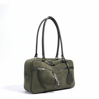 Olive green suede handbag with dual black leather straps and silver zipper accents