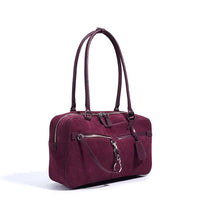 Burgundy suede leather handbag with long straps and front zip pocket on white background
