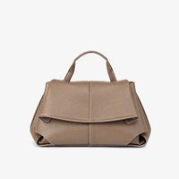 Taupe leather handbag with top handle and front flap on white background